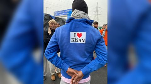 A farmer sports a protest slogan meaning "I love farmers" at a protest camp in Ghazipur, on February 4, 2021.