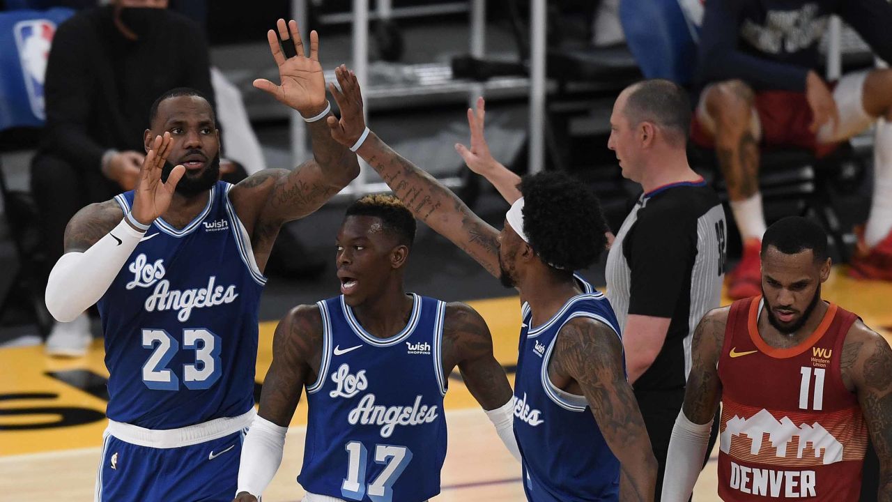 James celebrates his basket with his Lakers teammates.