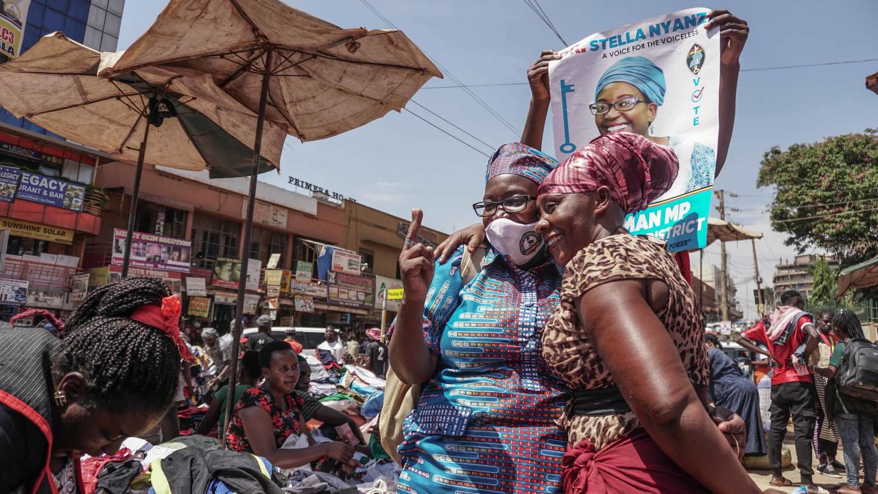 A supporter with Stella Nyanzi, left, ahead of the election, in Kampala on October 28, 2020.