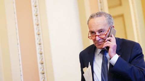 Schumer talks on his phone before the Senate impeachment vote on Capitol Hill in Washington, DC on February 5, 2020. 