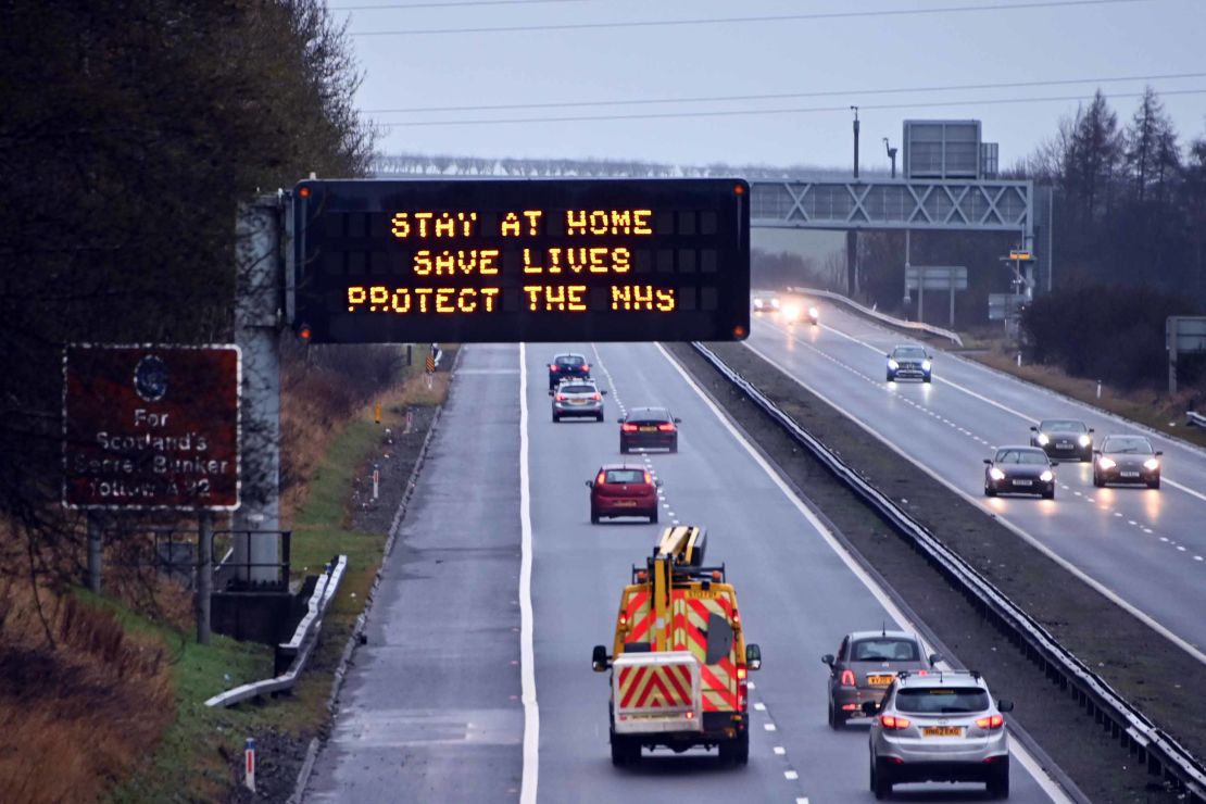 An illuminated motorway sign carries the "Stay At Home" message, on January 10 in Dunfermline, Scotland.