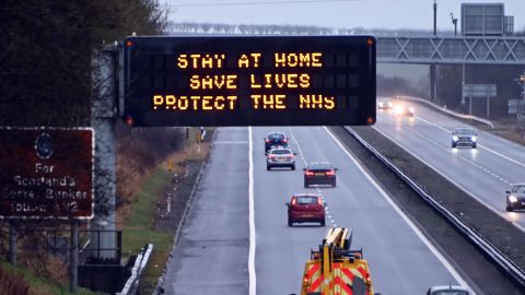 An illuminated motorway sign carries the "Stay At Home" message, on January 10 in Dunfermline, Scotland.