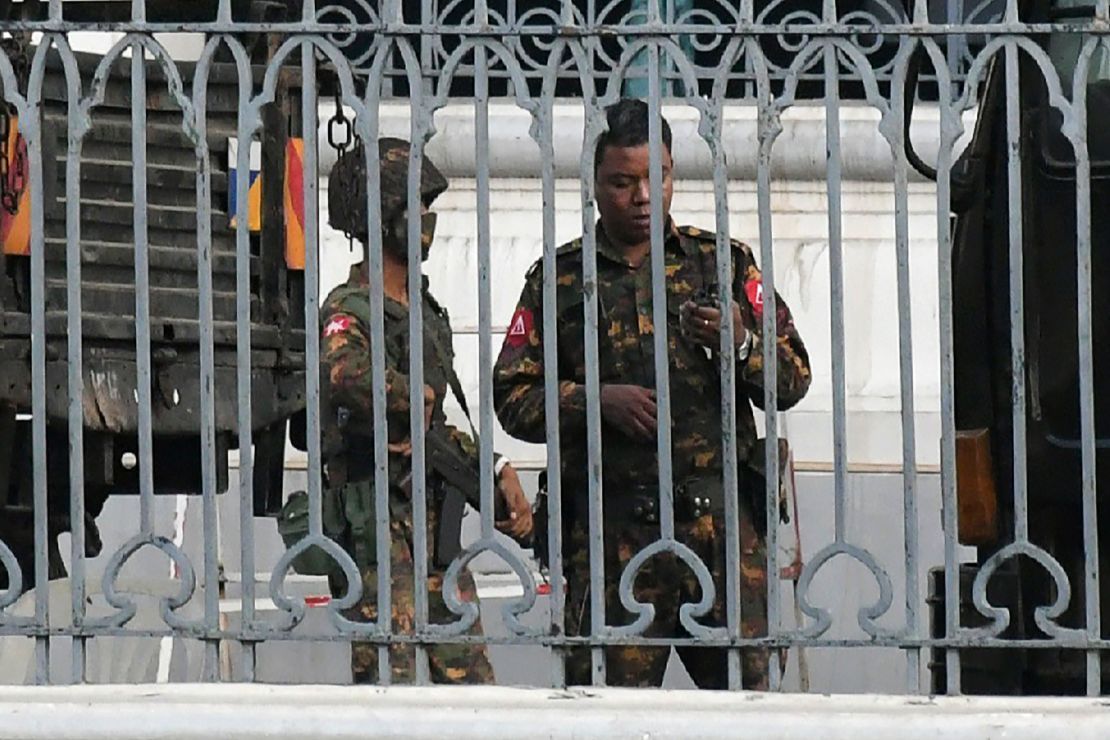 Soldiers keep watch inside the City Hall compound in Yangon on February 1, 2021.