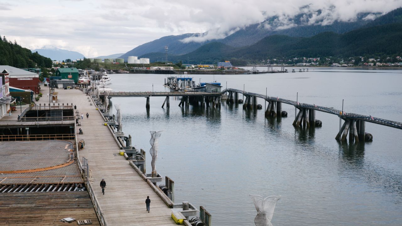 Pedestrians walk through an empty cruise ship port in Juneau, Alaska, U.S., on Wednesday, 22, 2020. Alaska experienced a 4.4% increase in the number of cases from the same time yesterday, bringing the total to 2,131, as of 6:56 a.m. New York time, according to data collected by Johns Hopkins University and Bloomberg News. Photographer: Meg Roussos/Bloomberg via Getty Images