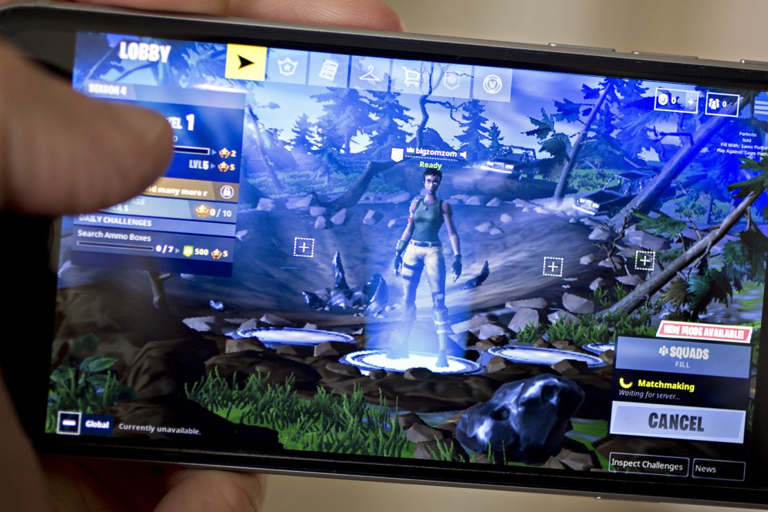 The Epic Games Inc. Fortnite: Battle Royale video game is displayed for a photograph on an Apple Inc. iPhone in Washington, D.C., U.S., on Thursday, May 10, 2018. Fortnite, the hit game that's denting the stock prices of video-game makers after signing up 45 million players, didn't really take off until it became free and a free-for-all. 