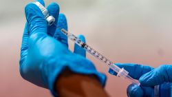 FILE — In this Jan. 31, 2021, file photo, pharmacist Diana Swiga fills a dead volume syringe with the Pfizer-BioNTech COVID-19 Vaccine, at a pop-up COVID-19 vaccination site at the Bronx River Houses Community Center, in the Bronx borough of New York. States including New York are wrestling with the decision of whether to allow medically vulnerable residents below the age of 65 to receive the coronavirus vaccine. (AP Photo/Mary Altaffer, File)