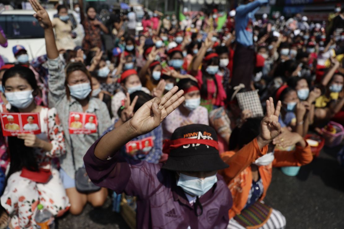 Protesters flash the three-finger salute during a demonstration against the military coup in Yangon, Myanmar, February 6.