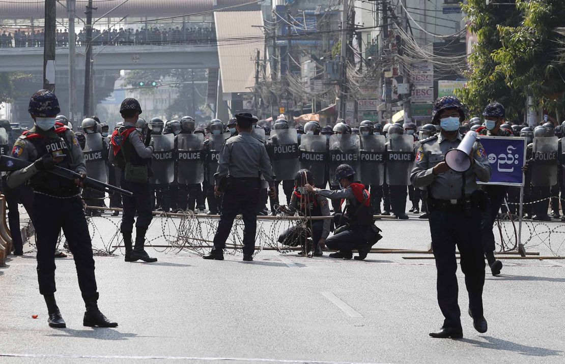 Riot police block a road in Yangon, Myanmar, 06 February 2021. 