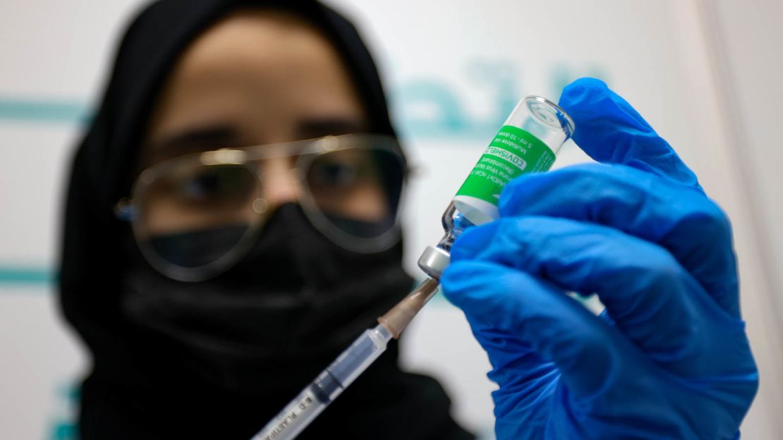 Pictured in February 2021, a Dubai health worker prepares an injection of the OxfordAstraZeneca vaccine. 