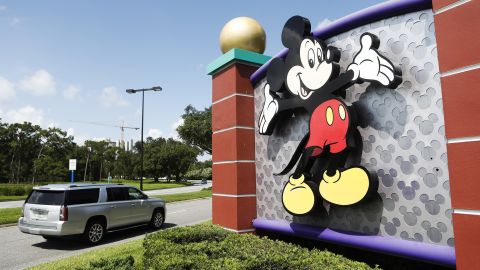 Mickey Mouse adorns a sign at an entrance to the Walt Disney World theme park in Florida.