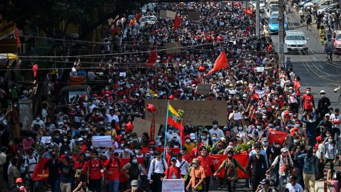 Protesters march during a demonstration against the military coup in Yangon on February 7, 2021. 
