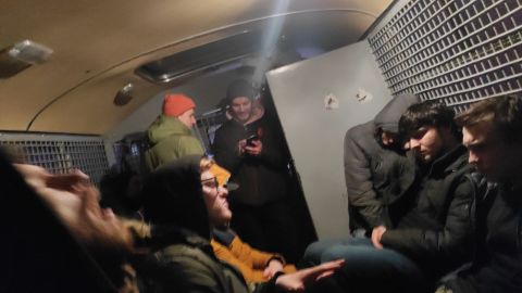 Detainees were forced to wait in cramped police vans as there is no space at detention centers.