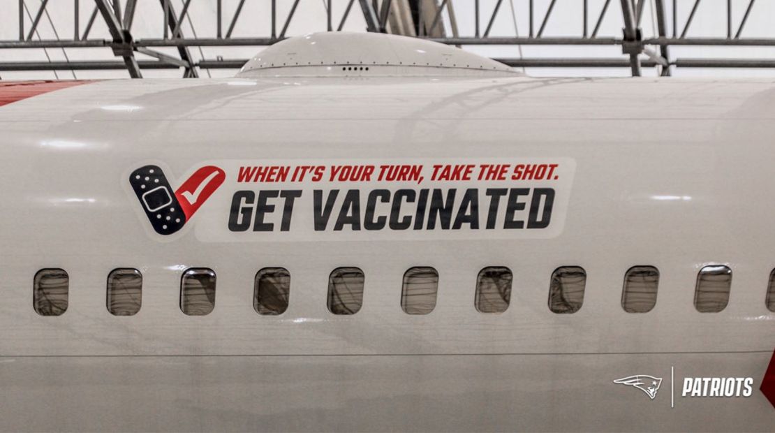 "When it's your turn, take the shot. Get vaccinated," the plane's decal reads.