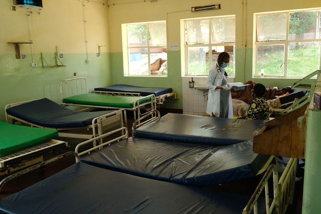 Dr. Tamara Phiri consults with a patient in a general ward. 