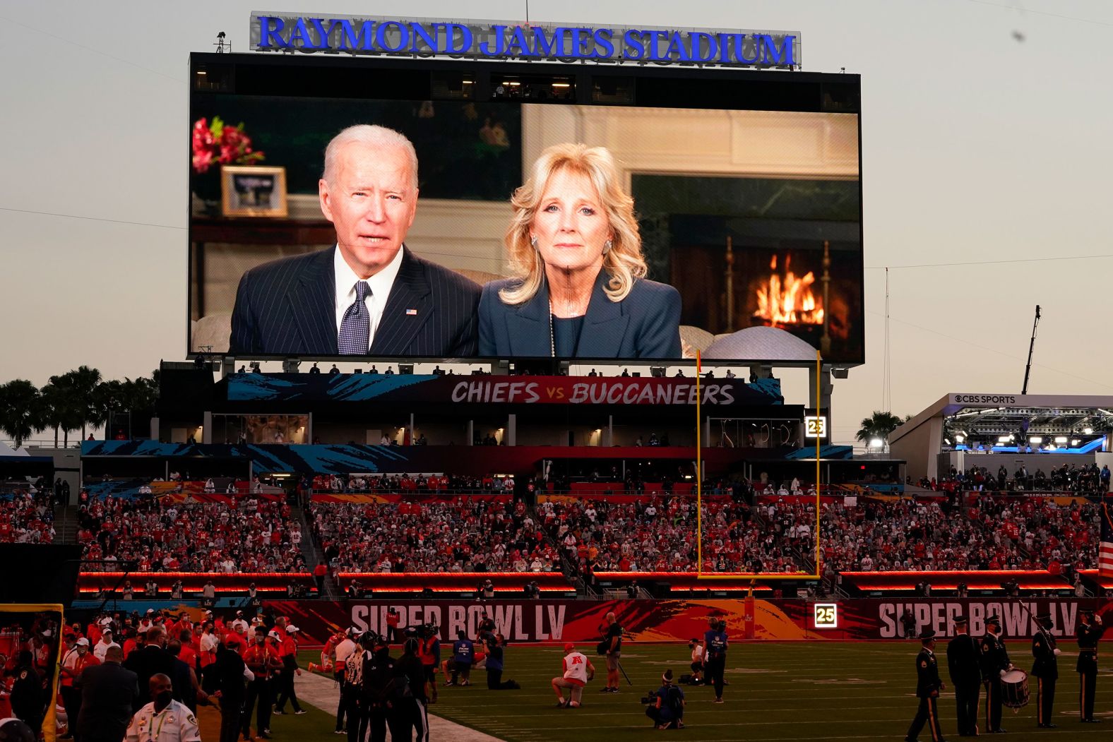 Fans at the stadium watch a pregame message from President Joe Biden and first lady Jill Biden.