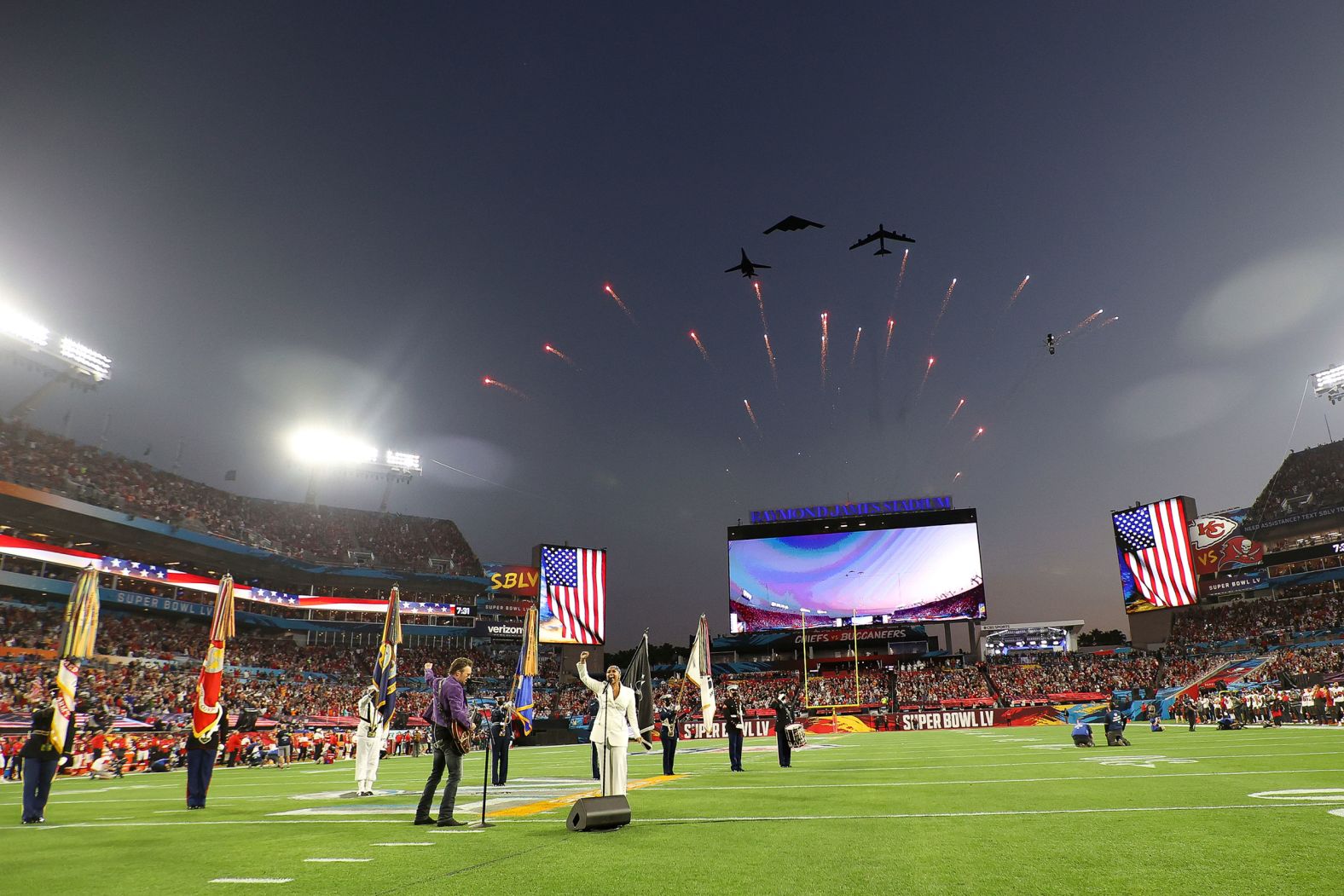 Jets fly over Raymond James Stadium as Eric Church and Jazmine Sullivan perform the National Anthem before the game.