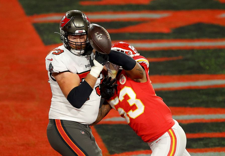 Kansas City linebacker Anthony Hitchens punches the ball away from Tampa Bay's Joe Haeg just prior to the Chiefs' stop on 4th-and-goal.