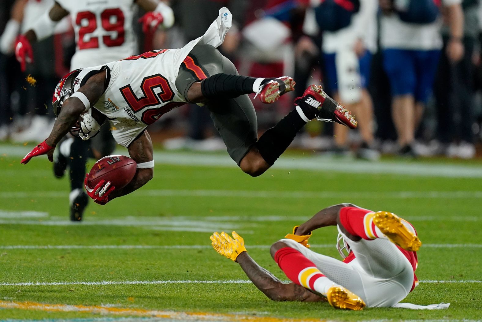 Kansas City's Byron Pringle tackles Tampa Bay punt returner Jaydon Mickens in the second quarter.