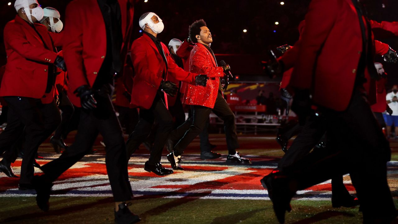 The Weeknd marches with backup dancers during the Super Bowl LV halftime show on Sunday, February 7.