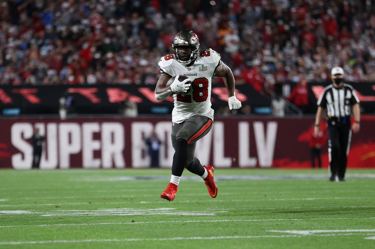 Tampa Bay running back Leonard Fournette rumbles for a third-quarter touchdown.