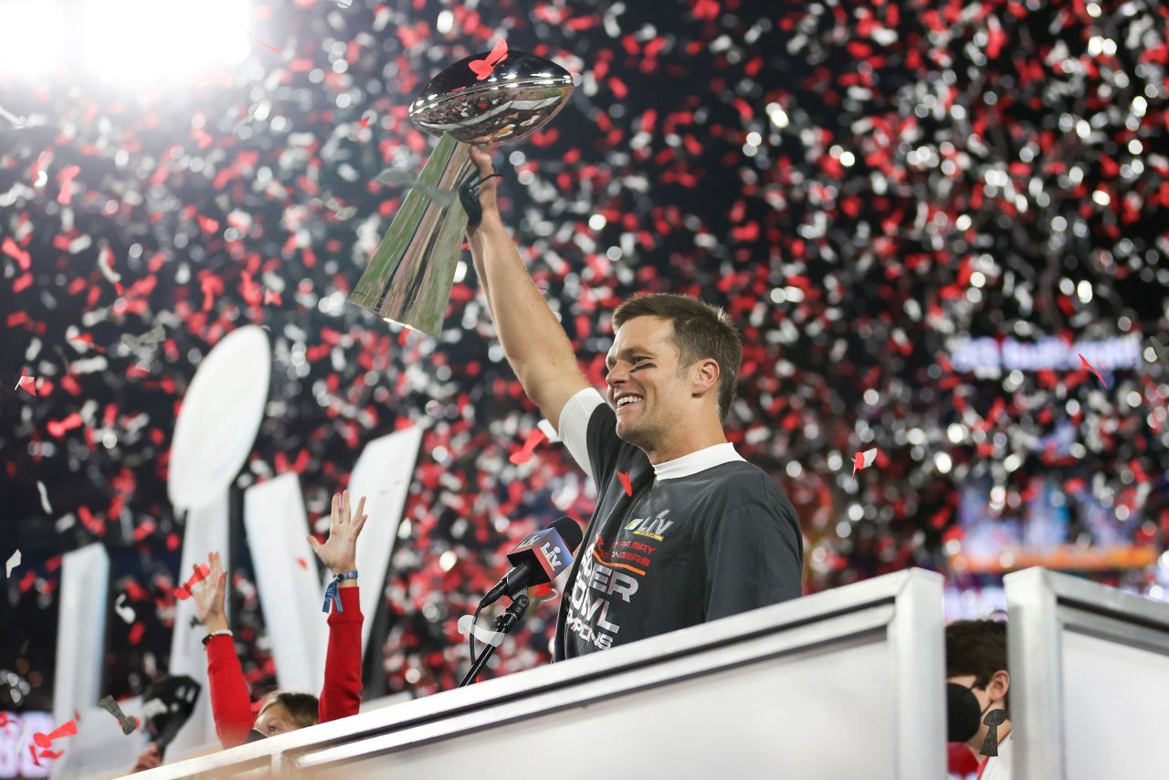 Brady holds the Vince Lombardi Trophy after the game.