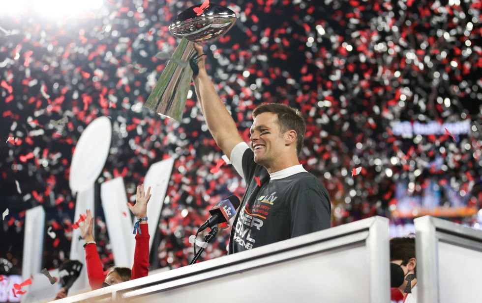 Tom Brady holds the Vince Lombardi Trophy after leading the Tampa Bay Buccaneers to a Super Bowl win in February 2021.