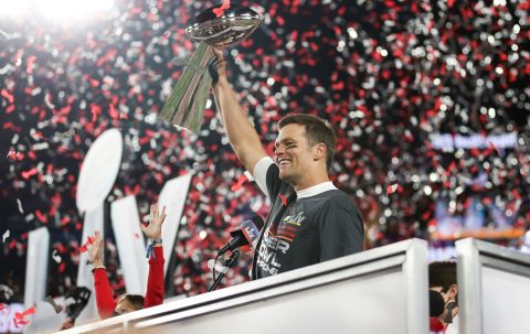 Tom Brady holds the Vince Lombardi Trophy after leading the Tampa Bay Buccaneers to a Super Bowl win in February 2021.