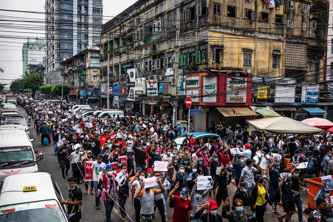 Protesters march through a street on February 8, 2021 in Yangon, Myanmar. 