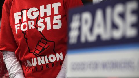 An activist wears a "Fight For $15" T-shirt during a news conference prior to a vote on the Raise the Wage Act July 18, 2019 at the U.S. Capitol in Washington, DC. The legislation would raise the federal minimum wage from $7.25 to $15 by 2025.  (Photo by Alex Wong/Getty Images)