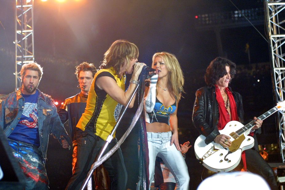 Spears performs with Aerosmith frontman Steven Tyler as part of the Super Bowl halftime show in 2001.
