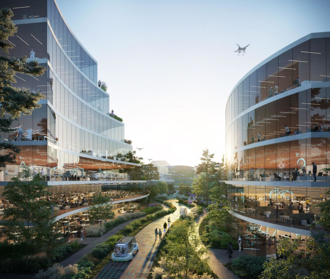 OMA's design for the educational park features curvilnear buildings with green terraces that complement the topography of the hilly landscape.