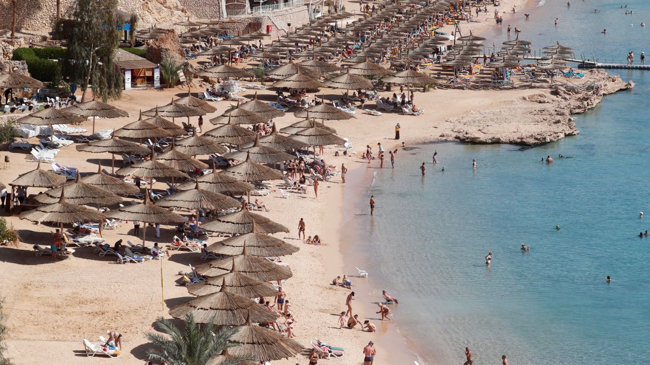 Tourists enjoy a day by the beach in the Red Sea resort of Sharm el-Sheikh, south of Cairo, Egypt on February 6, 2021. 