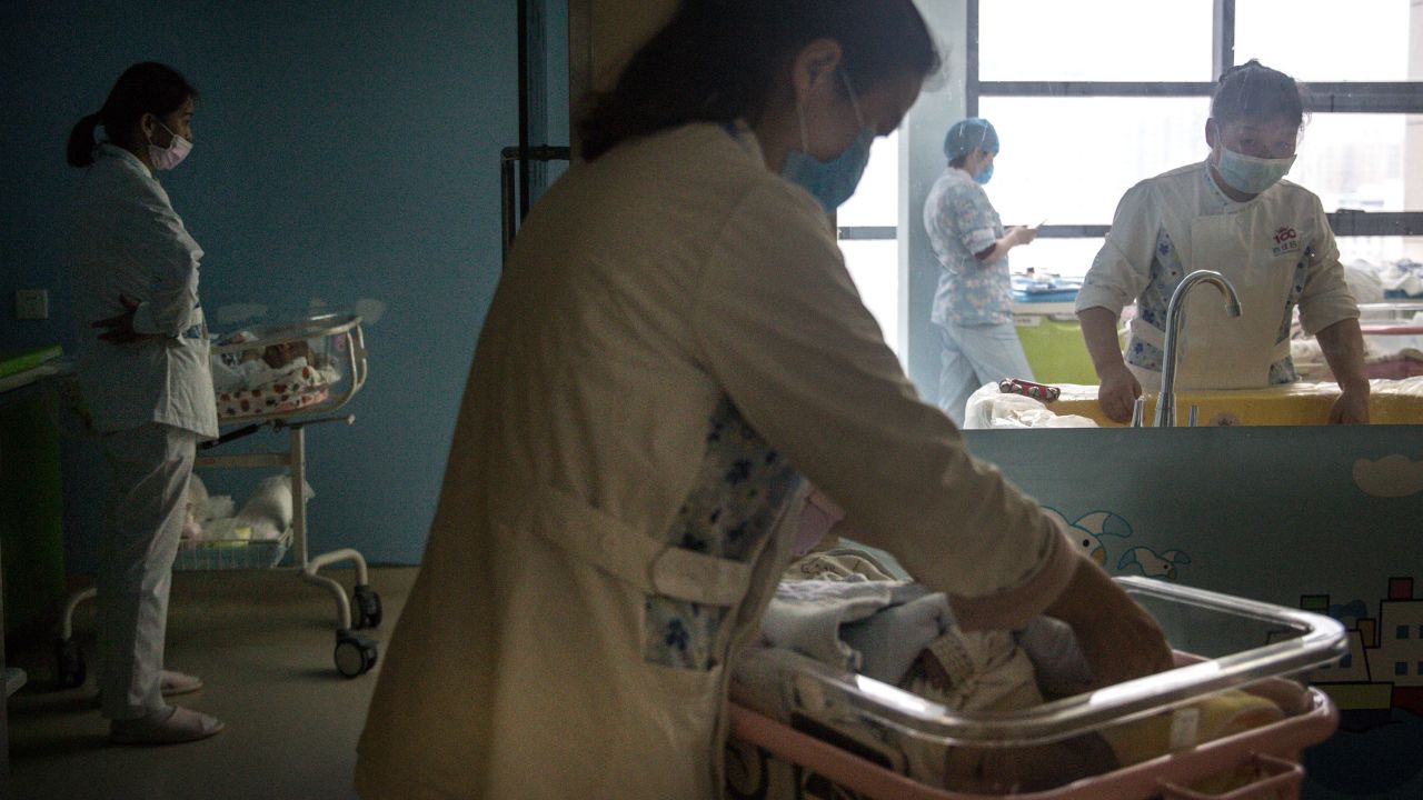 A maternity nurse at a private hospital in Wuhan, China cares for a newborn on March 12, 2020.