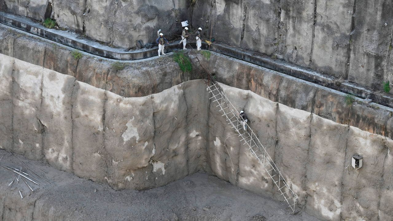 Indian army personnel climb down a makeshift ladder in Tapovan dam during rescue efforts to locate missing workers on Tuesday.