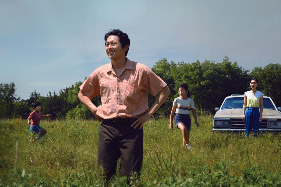 Steven Yeun (center) is shown in a scene from "Minari" with (from left) Alan S. Kim, Noel Cho and Yeri Han.