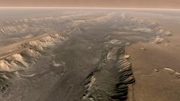 VALLES MARINERIS, MARS  - Mars' own Grand Canyon, Valles Marineris, is shown on the surface of the planet in this composite image made aboard NASA's Mars Odyssey spacecraft. The image was taken from a video featuring high-resolution images from Arizona State University's Thermal Emission Imaging System multi-band camera on board the spacecraft. The mosaic was then colored to approximate how Mars would look to the human eye. Valles Marineris is 10 times longer, five times deeper and 20 times wider than Earth's Grand Canyon.  (Photo by NASA/Arizona State University via Getty Images)