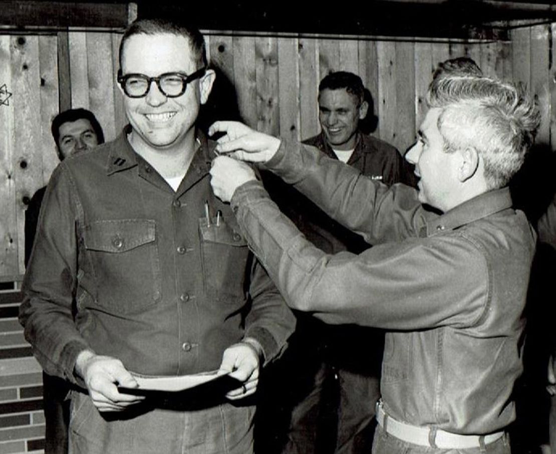 Grisham, left, was promoted to lieutenant while serving in Antarctica.