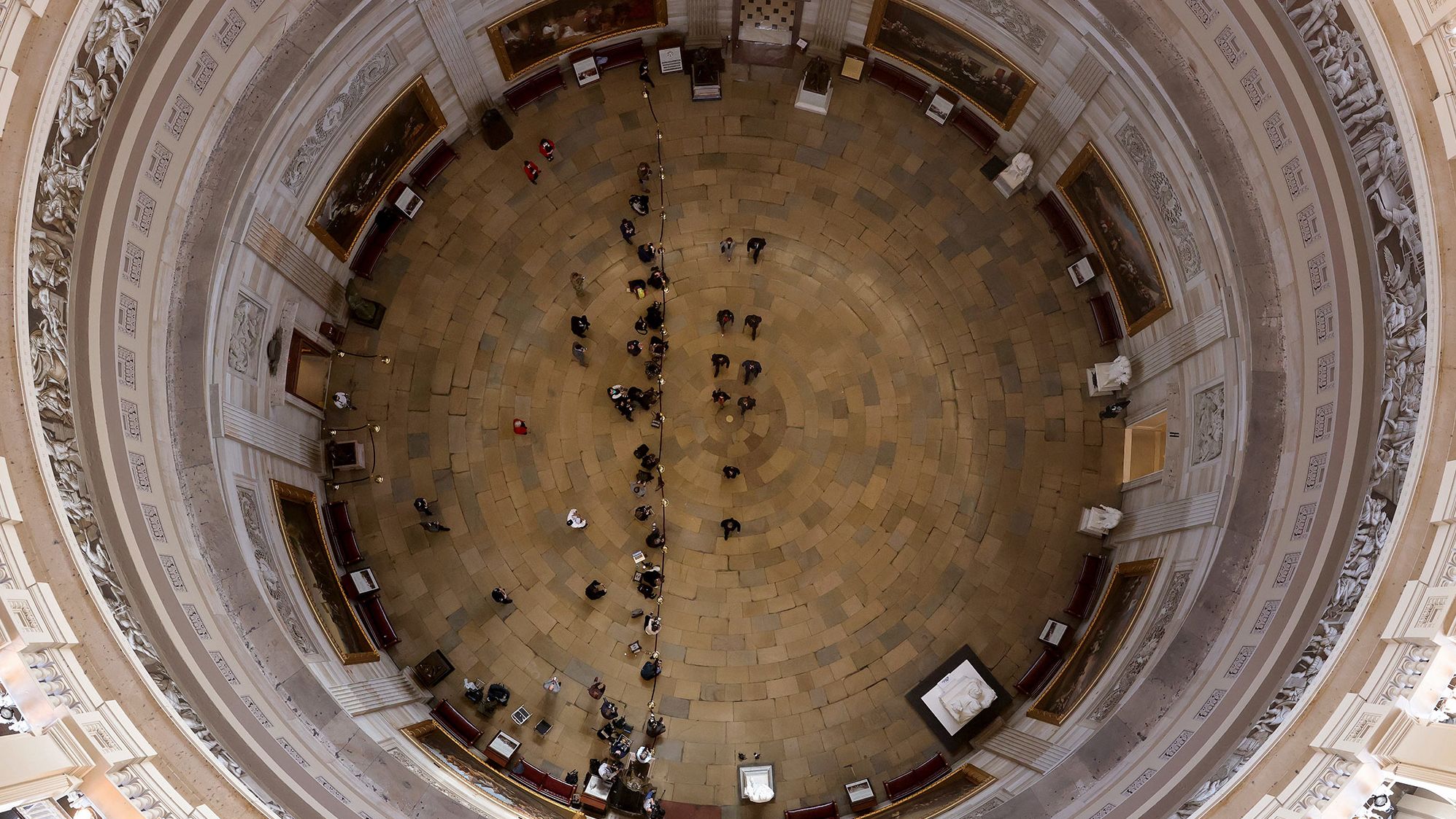 The House impeachment managers walk through the US Capitol Rotunda on Tuesday, February 9.
