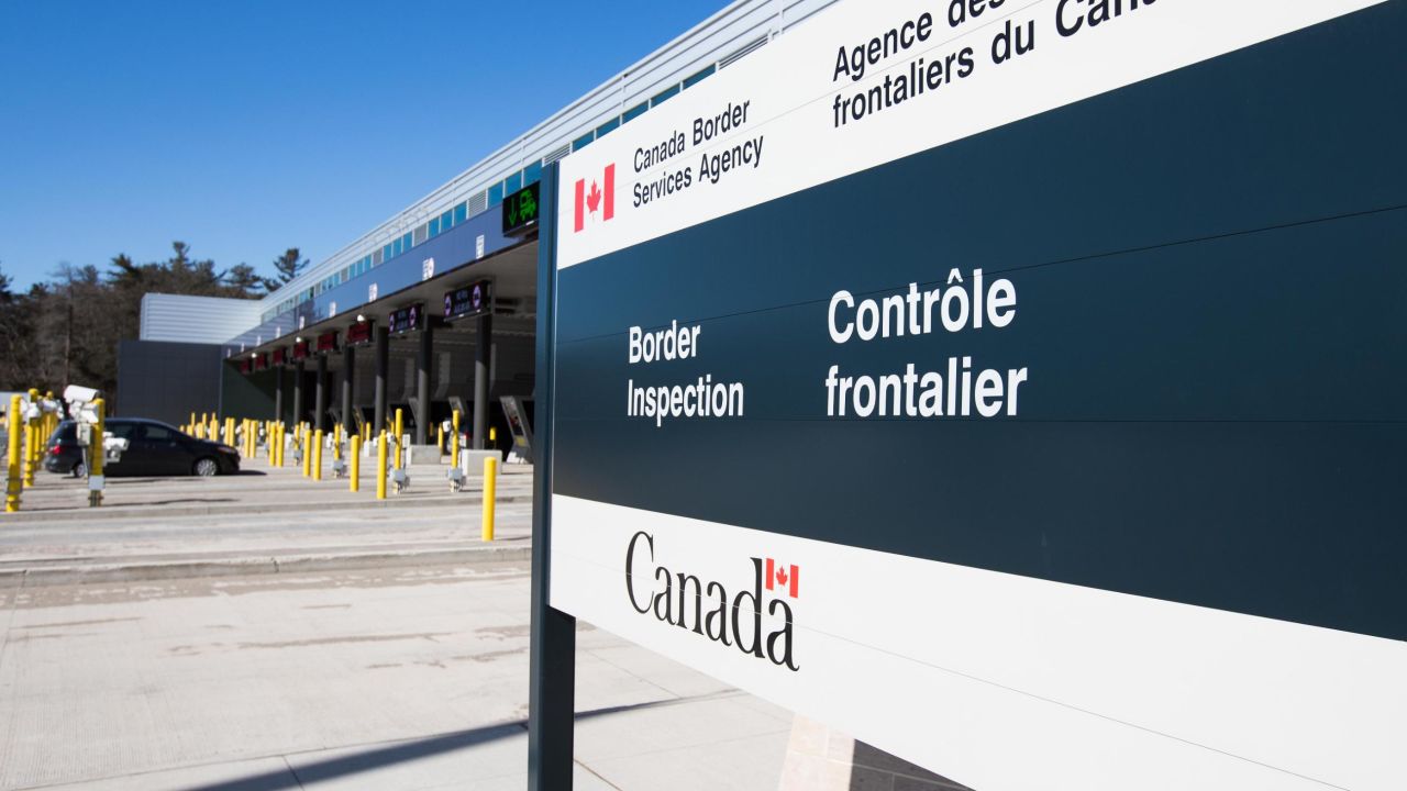 A vehicle enters a Canadian border station at the US/Canada border after the two countries closed their border for all non-essential travel in Lansdowne, Ontario, on March 22, 2020. - The United States agreed with Mexico and Canada to restrict non-essential travel because of the coronavirus, COVID-19, outbreak and is planning to repatriate undocumented immigrants arriving from those countries. (Photo by Lars Hagberg / AFP) (Photo by LARS HAGBERG/AFP via Getty Images)