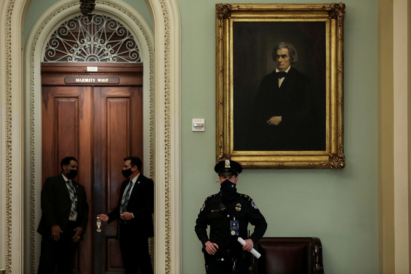 A Capitol Police officer stands watch as senators arrive at the Senate Chamber on Tuesday.