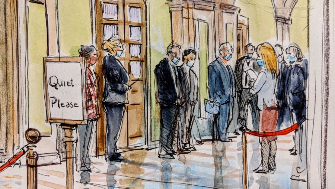 Journalists wait outside the Senate chamber to cover the second impeachment trial of former President Donald Trump on February 9, 2021.