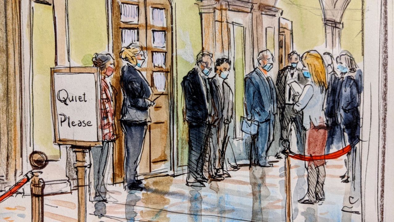 Journalists wait outside the Senate chamber to cover the second impeachment trial of former President Donald Trump on February 9, 2021.