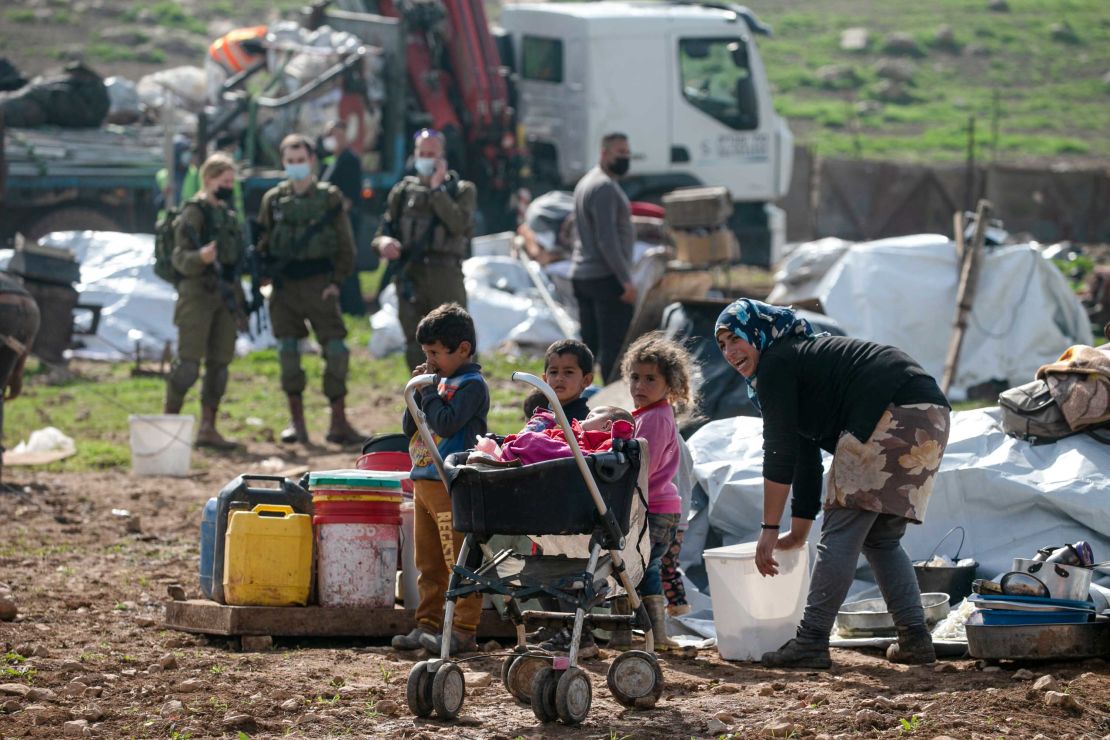 Residents react as Israeli forces demolish tents and structures near Tubas on February 8, 2021. 