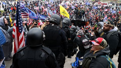 Roberto Minuta, on right with goggles, joins demonstrators on the steps of the eastern side of the US Capitol.