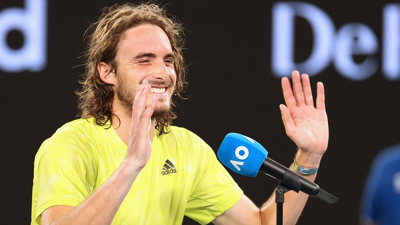 Stefanos Tsitsipas laughs while giving his interview.