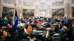 Police clash with rioters who breached security and entered the Capitol building in Washington DC, on January 6. 