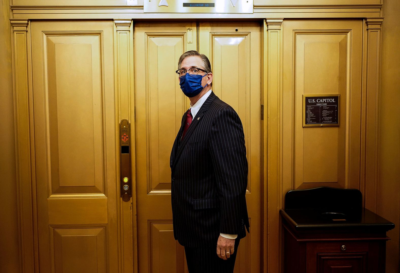 Bruce Castor, one of the attorneys representing Trump, waits for an elevator during a break in the trial's second day on Wednesday.