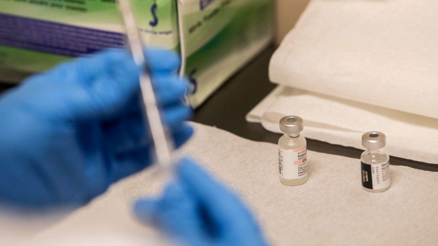 A nurse dilutes and prepares Covid-19 vaccines at a clinic setup at the East Alabama Medical Center Education Center in Montgomery, Alabama, on December 16, 2020.