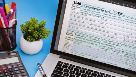 underscored tax software 1040 form on laptop screen