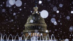 Snow falls outside the U.S. Capitol in Washington, D.C., U.S. on Wednesday, Feb. 10, 2021. House Democrats used searing video footage from last months deadly rampage at the U.S. Capitol to begin Donald Trumps second impeachment trial on a dramatic note, yet the prosecution remains far from winning enough GOP votes to convict the former president. Photographer: Ting Shen/Bloomberg via Getty Images